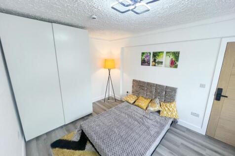 A modern double bedroom featuring a comfortable...