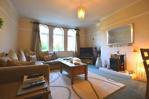 A cozy and inviting living room featuring a lar...