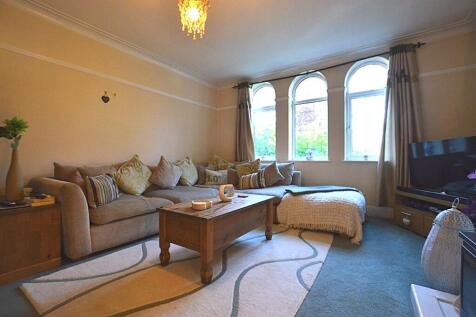 A cozy and inviting living room featuring a lar...