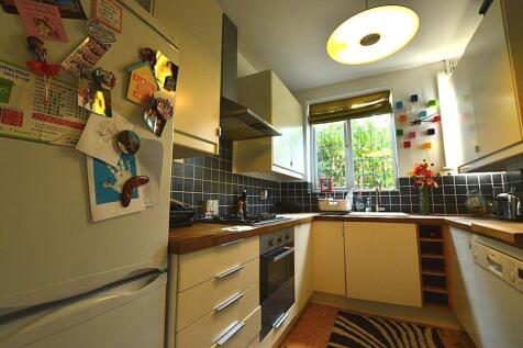 A bright and inviting kitchen featuring modern ...
