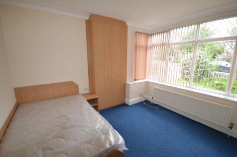 Bright single bedroom featuring a large corner ...