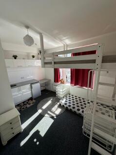 Bright and modern living space with large windo...