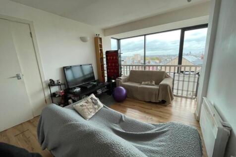 Bright living room with large floor-to-ceiling ...