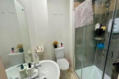 Bright and modern bathroom featuring a spacious...