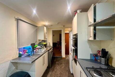 A tidy and functional galley kitchen with moder...