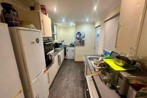 A functional kitchen featuring ample countertop...