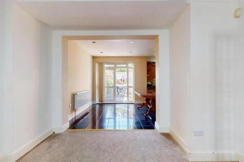 A bright and inviting living room featuring a s...