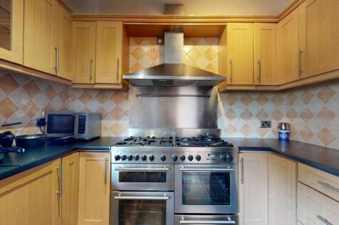 A well-maintained traditional kitchen featuring...