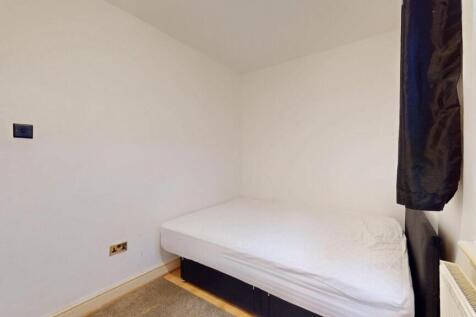 Cozy single bedroom with a clean and simple des...