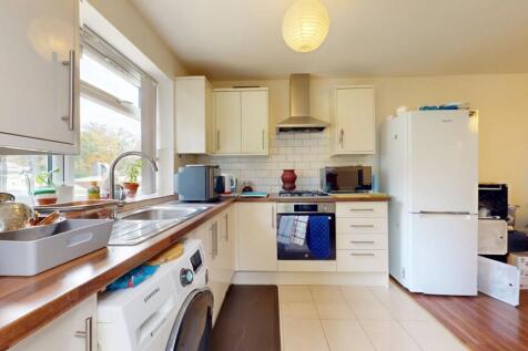 Bright and well-equipped kitchen featuring ampl...