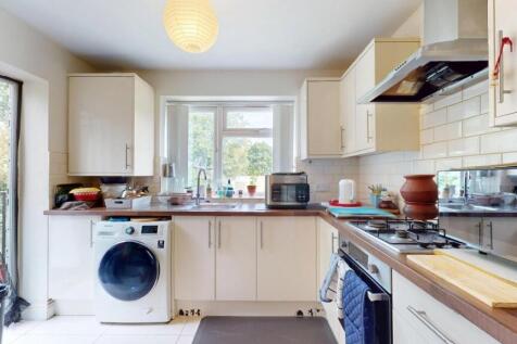 Bright and modern kitchen with ample natural li...