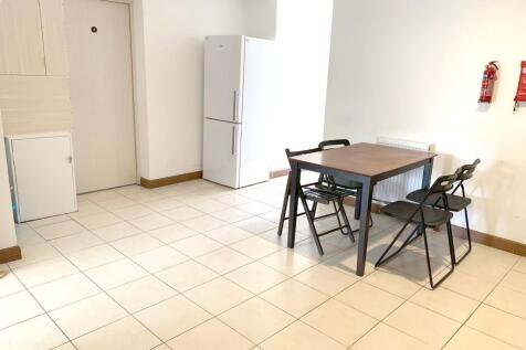 Bright communal lounge area featuring a clean t...