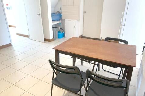 Bright, clean communal lounge area featuring a ...