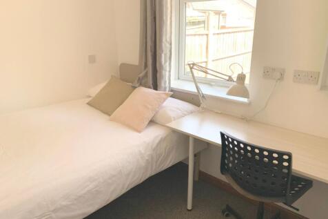 Bright and tidy single bedroom featuring a comf...
