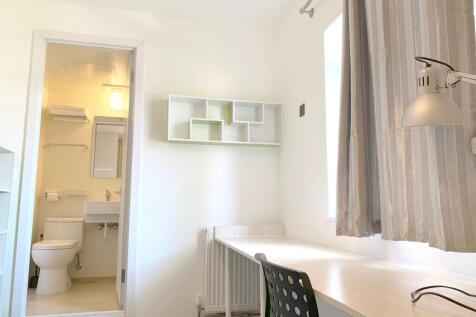 A bright and clean small bathroom area featurin...