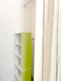 Bright and tidy storage area featuring a modern...