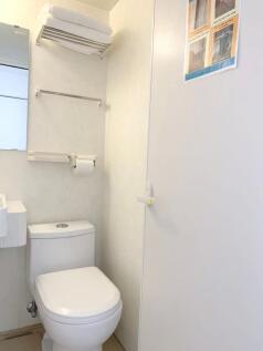 A clean and well-maintained compact toilet area...