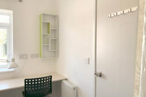 Bright and tidy study corner with a large windo...