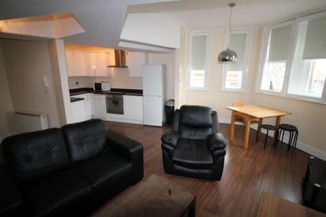 A contemporary open-plan living room with a com...