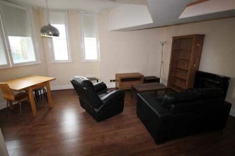 A contemporary living room featuring comfortabl...