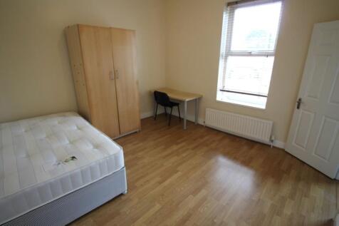 Bright, tidy double bedroom featuring a large w...