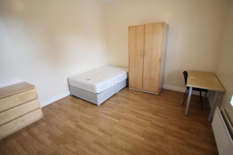 A bright single bedroom featuring a tidy layout...