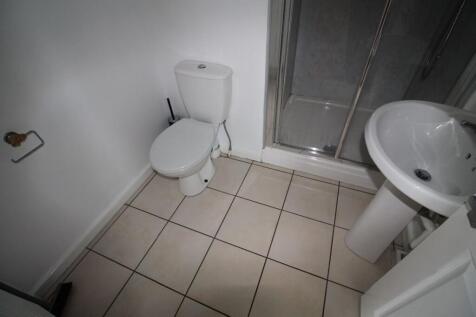 Bright and clean bathroom featuring a white toi...