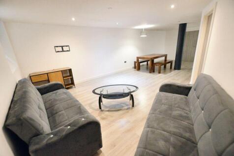 A modern living room featuring two comfortable ...