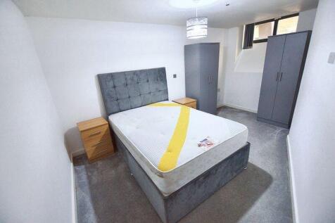 A modern double bedroom featuring a comfortable...