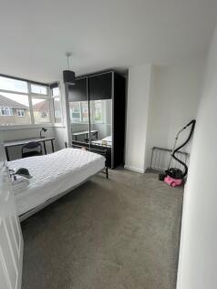 Bright and tidy double bedroom featuring a comf...