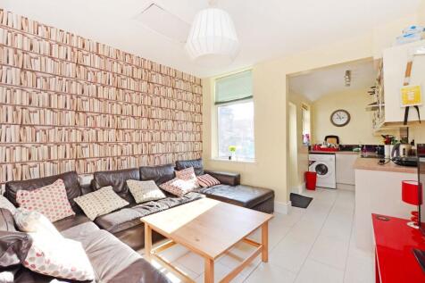 Bright and inviting living room featuring a lar...