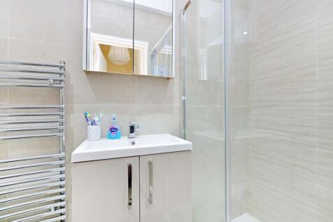 A modern, well-maintained bathroom featuring a ...