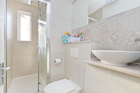 Bright and modern bathroom featuring a sleek wa...