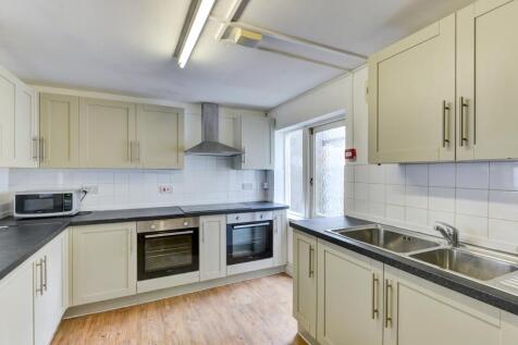 Bright and clean kitchen featuring modern appli...
