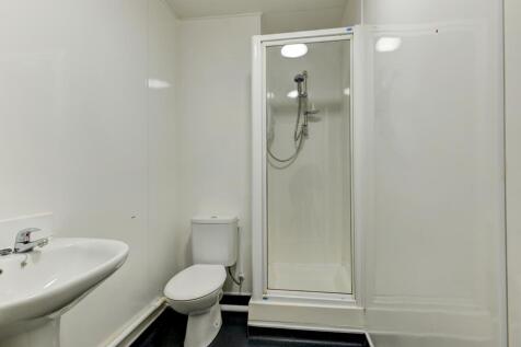 A clean and functional bathroom featuring a cor...