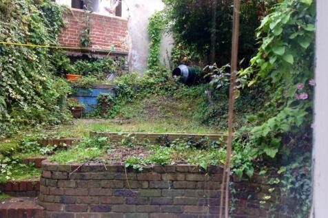 A charming garden space with lush greenery and ...