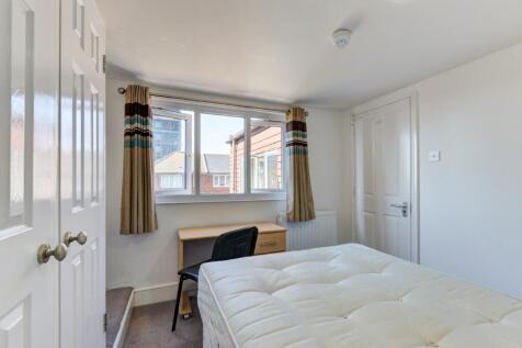 Bright and inviting master bedroom featuring a ...