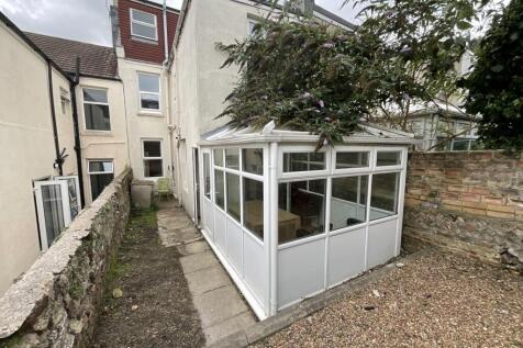View of the front of a terraced house featuring...