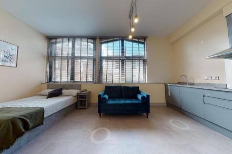 Bright and spacious living area featuring large...