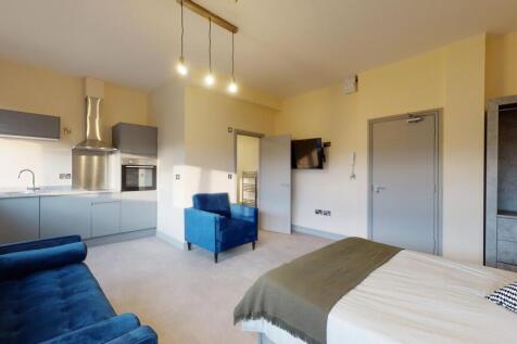 A bright and modern living area featuring a blu...