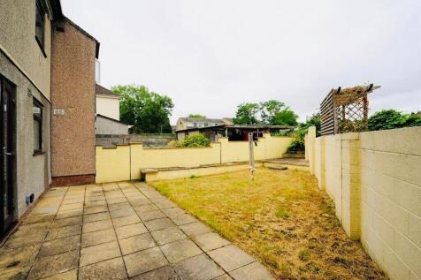 A private garden featuring a paved patio area a...