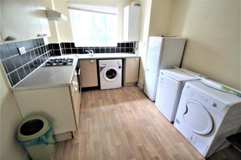 A well-equipped kitchen featuring a washing mac...