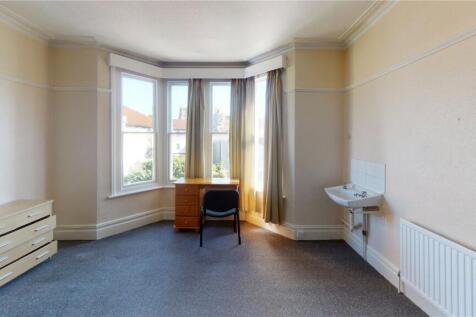 Bright and tidy room with a large bay window al...
