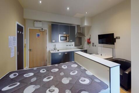 A modern and compact studio bedroom with a comf...