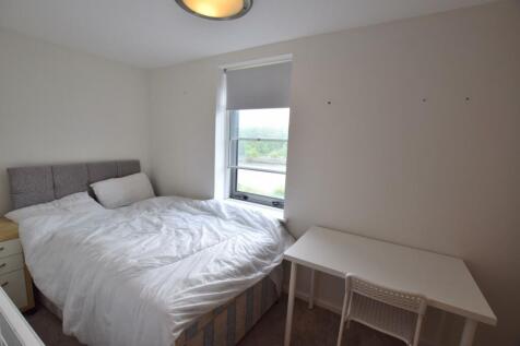 Bright and cozy double bedroom featuring a comf...
