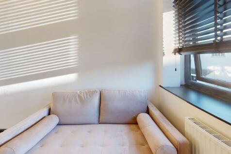 Bright and airy living room illuminated by natu...