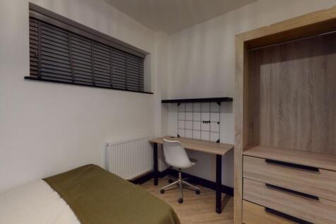 A cozy and neatly maintained single bedroom fea...