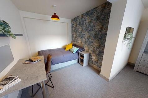A cozy and well-maintained student bedroom feat...