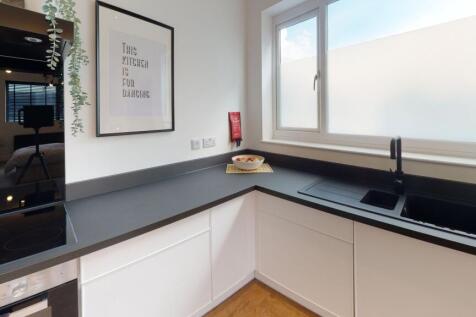 Bright, modern kitchen with ample natural light...