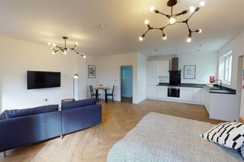 Bright and spacious living room featuring moder...
